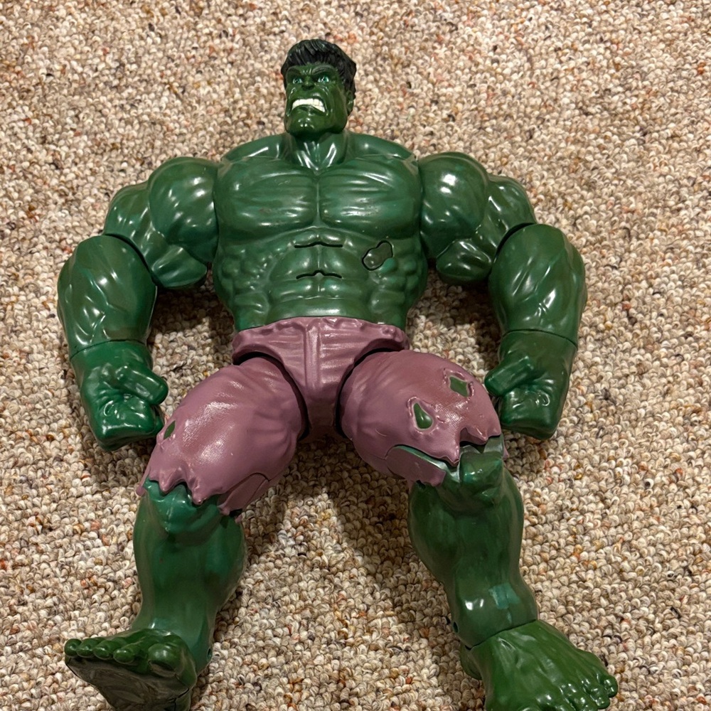 Hulk marvel action figure. 14 inches tall. Movable arms and legs. Makes sounds.
